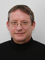 Dr.  René Küpper